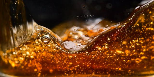 detail of an alcoholic beverage on black background